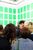 Besucher des Weltformat Graphic Design Festivals mit einem iPhone in der Hand